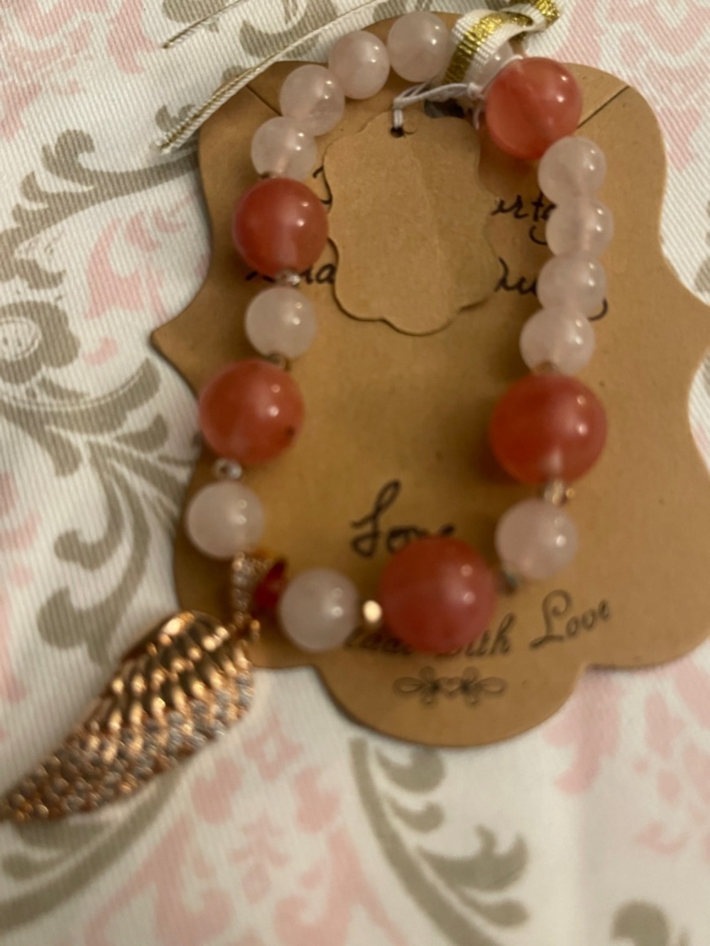Rose Quartz and Coral Bead Stretch Bracelet with Gold Wing Charm